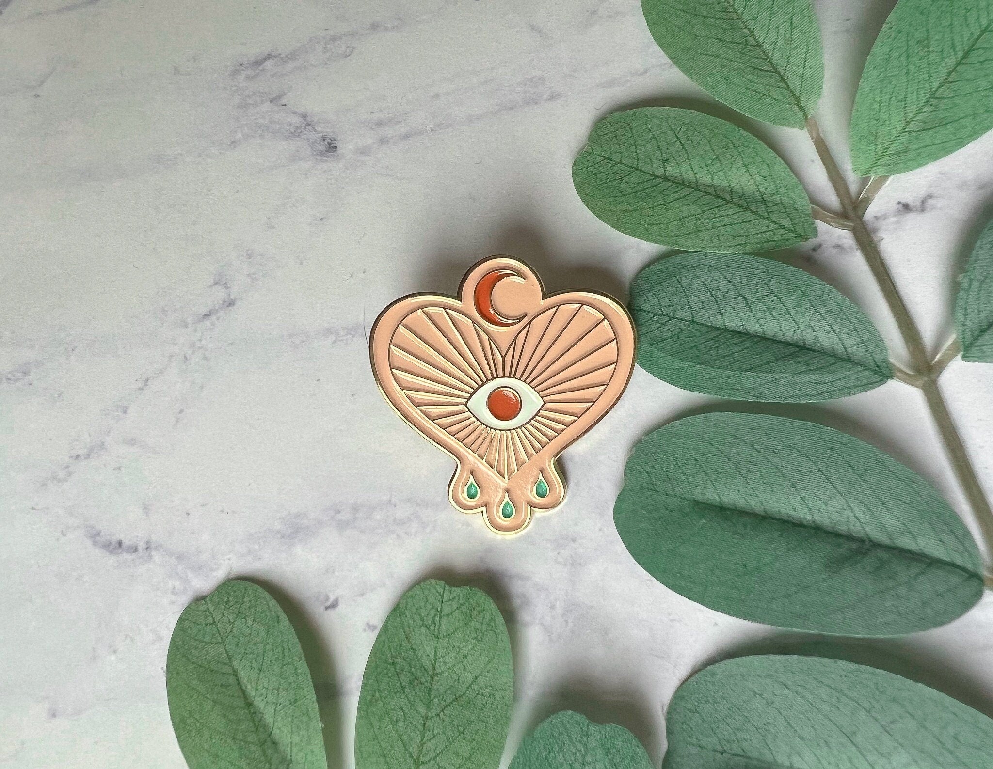 Evil Eye Heart Enamel Pin: Gold Metal Crybaby Design